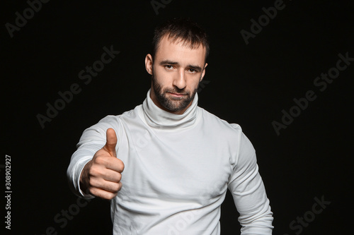 Portrait of young man showi...