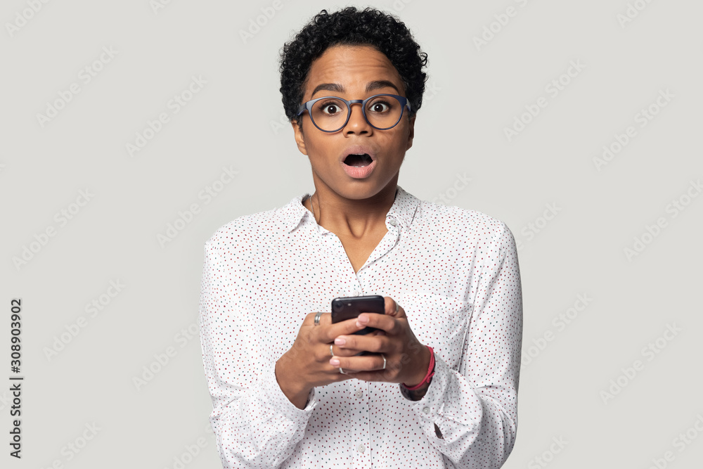 Head shot baffled black girl received sms with unexpected news. Head shot baffled black girl received sms with unexpected news.