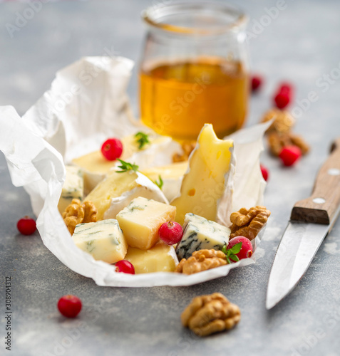 Delicious soft cheese served with honey and cranberry