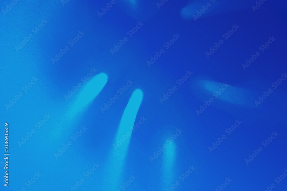 Bright Blue color tropical palm leaf shadow in trendy duotone neon background. Bright Blue color tropical palm leaf shadow in trendy duotone neon background.