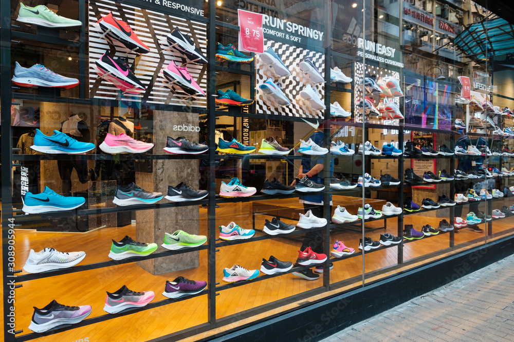 Overtreden Trots Trottoir Nike sneakers in in shop window at sneaker street in Hongkong - November,  2019 Stock Photo | Adobe Stock