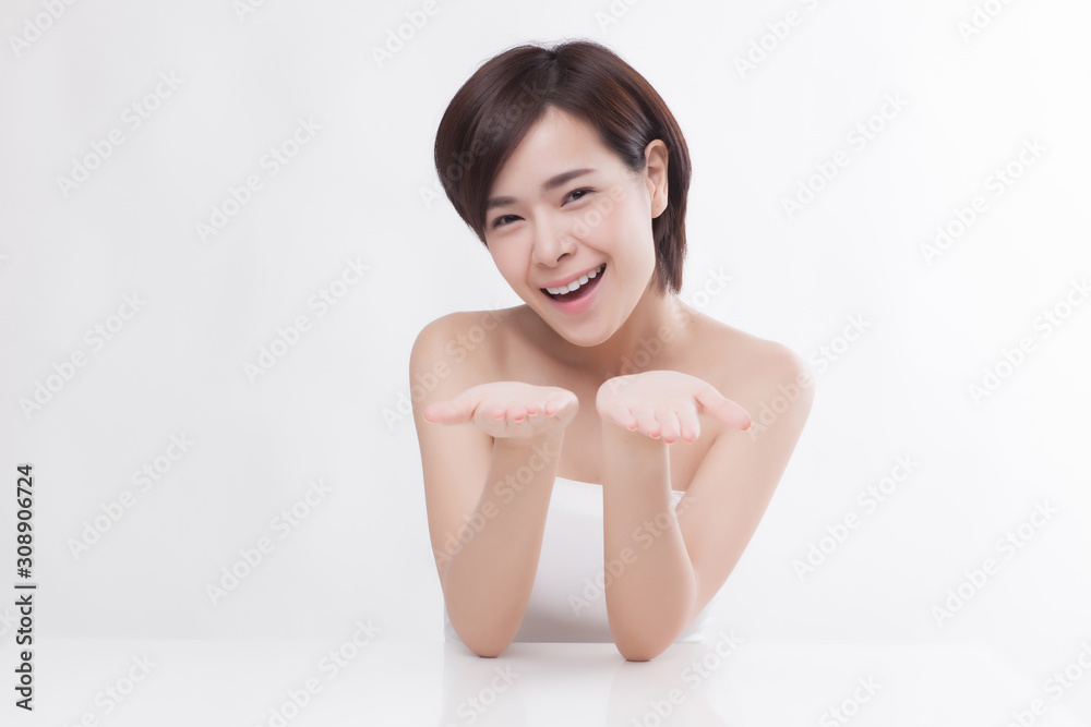 Young beautiful Asian female model on the white background Young beautiful Asian female model on the white background
