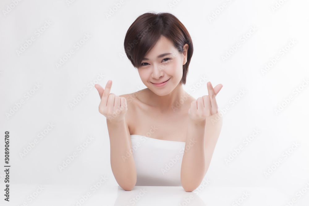 Young beautiful Asian female model on the white background Young beautiful Asian female model on the white background