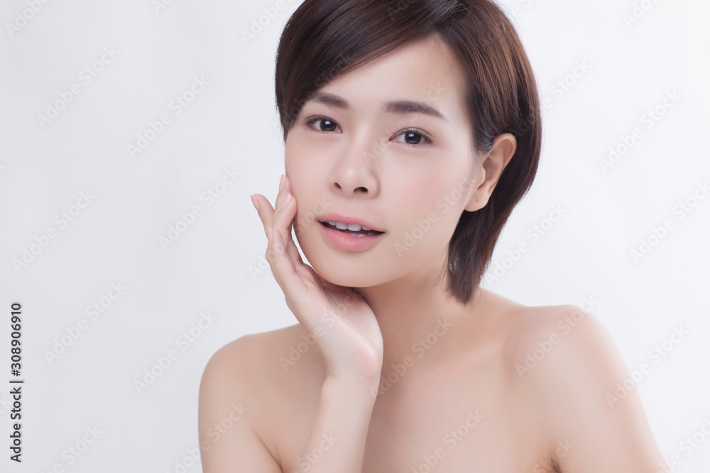 Young beautiful Asian female model on the white background Young beautiful Asian female model on the white background