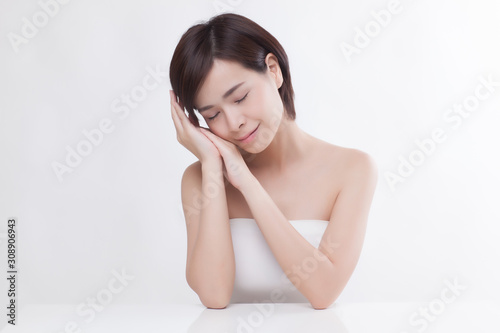 Young beautiful Asian female model on the white background