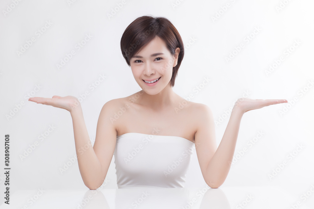 Young beautiful Asian female model on the white background Young beautiful Asian female model on the white background