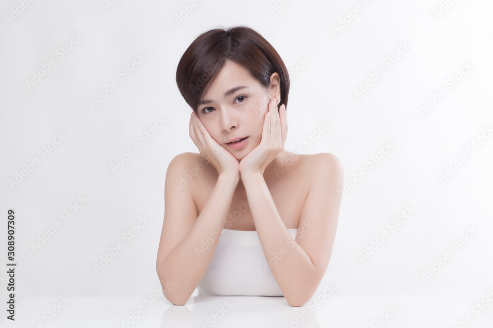 Young beautiful Asian female model on the white background Young beautiful Asian female model on the white background