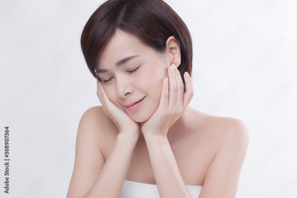 Young beautiful Asian female model on the white background Young beautiful Asian female model on the white background