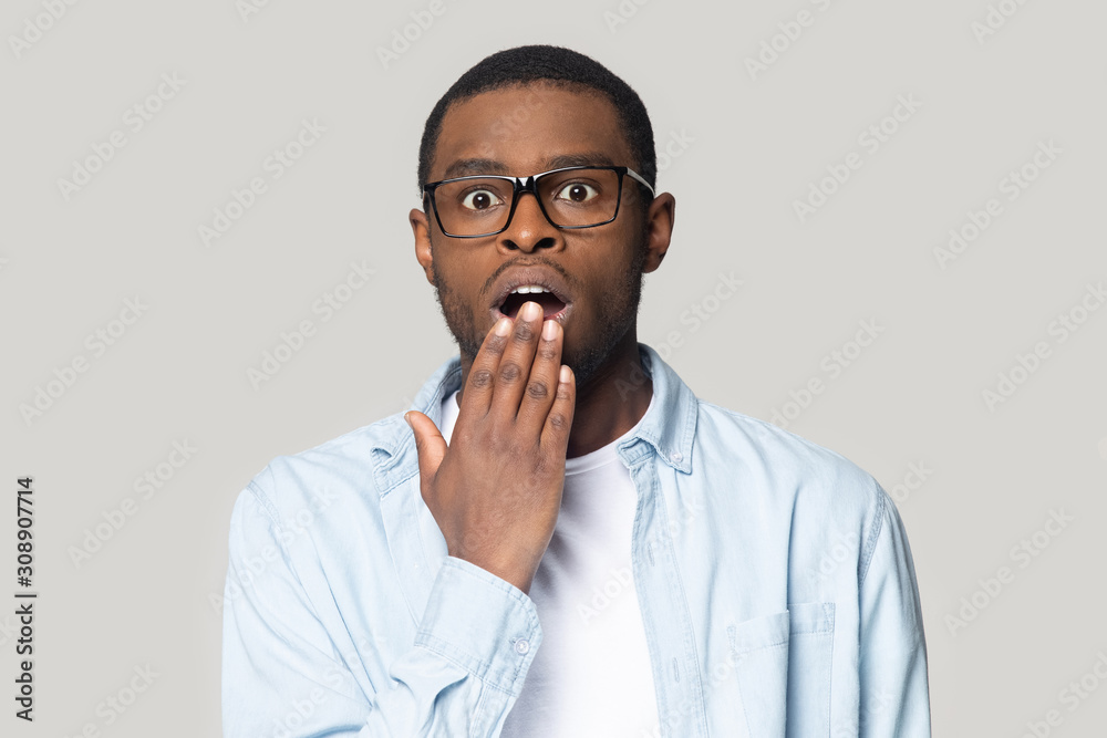 Surprised young african american man looking at camera. Surprised young african american man looking at camera.