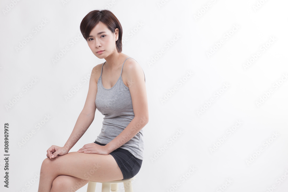 Young beautiful Asian female model on the white background Young beautiful Asian female model on the white background