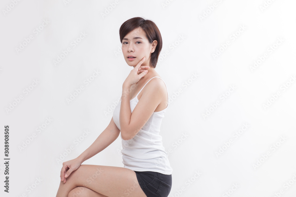 Young beautiful Asian short hair female model on white background Young beautiful Asian short hair female model on white background