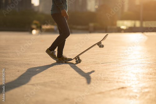 Skateboarder skateboarding at sunset city © lzf