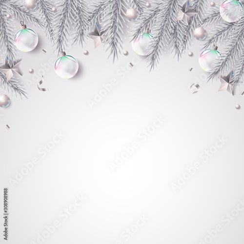 Christmas background with fir branches and dwcorations in elegant white and silver color