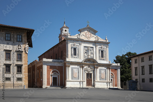 View on the square in front of italian church. Ornate facade of Church of Santo Stefano dei Cavalieri  Piazza dei Cavalieri. No people. Pisa  Italy
