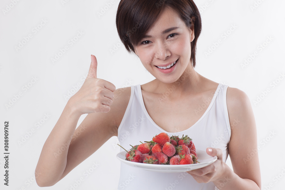 Young beautiful Asian female model on the white background for business concept Young beautiful Asian female model on the white background for business concept