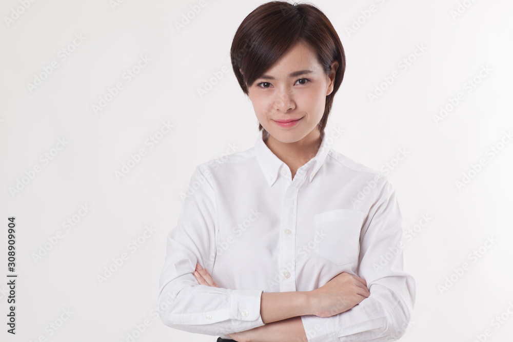 Young beautiful Asian female model on the white background for business concept Young beautiful Asian female model on the white background for business concept