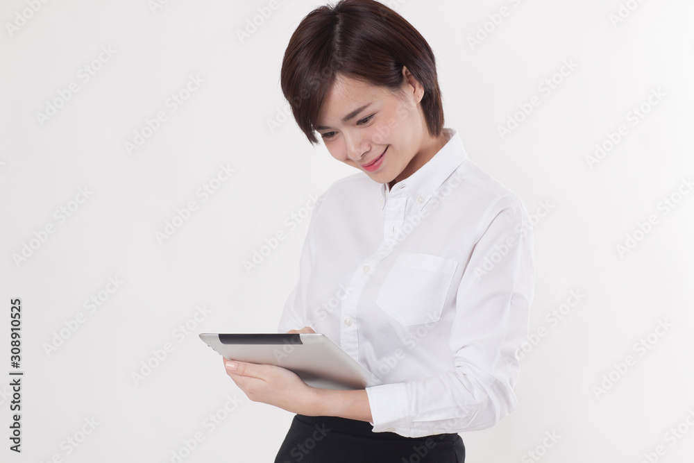 Young beautiful Asian female model on the white background for business concept Young beautiful Asian female model on the white background for business concept