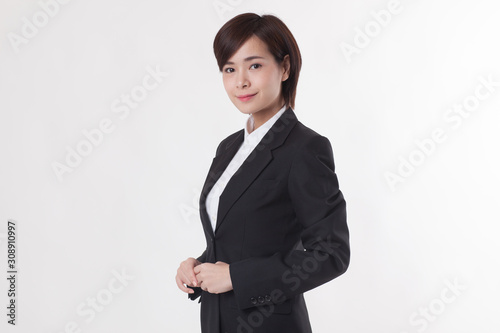 Young Asian short hair female model in formal dress which is good for business purpose