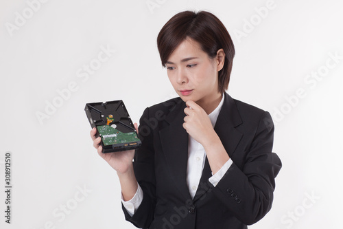 Young Asian short hair female model in formal dress which is good for business purpose