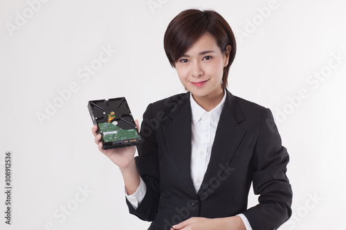 Young Asian short hair female model in formal dress which is good for business purpose