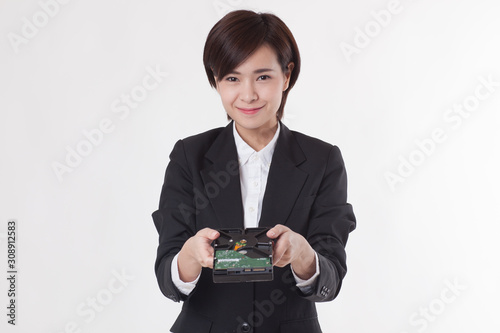 Young Asian short hair female model in formal dress which is good for business purpose