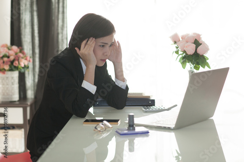 Young Asian short hair female model in formal dress which is good for business purpose