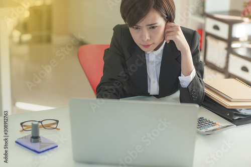 Young Asian short hair female model in formal dress which is good for business purpose