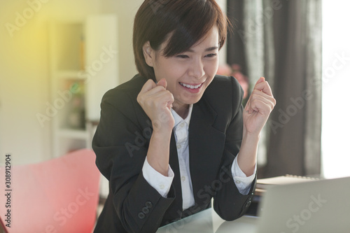 Young Asian short hair female model in formal dress which is good for business purpose