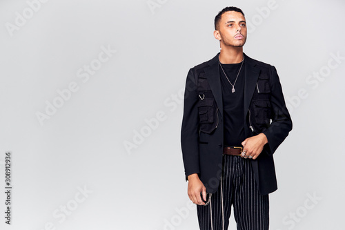 Studio Portrait Of Young Man With Skin Pigmentation Disorder Looking Off Camera