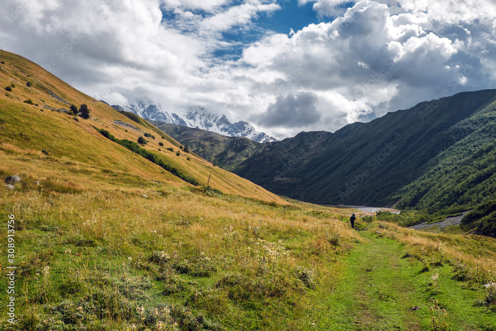 Beautiful mountain valley in Svaneti Georgia on a cunny partly cloudy day with mountain