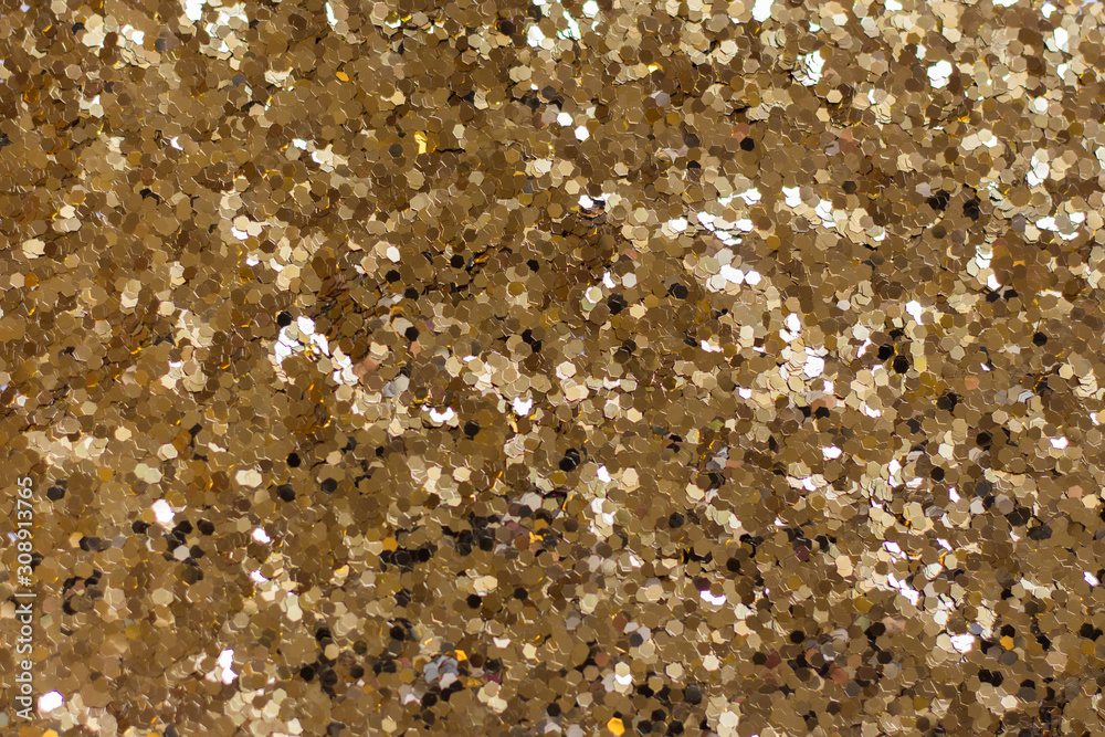 Gold glitter sparkles on a white background. Texture. Gold glitter sparkles on a white background. Texture.