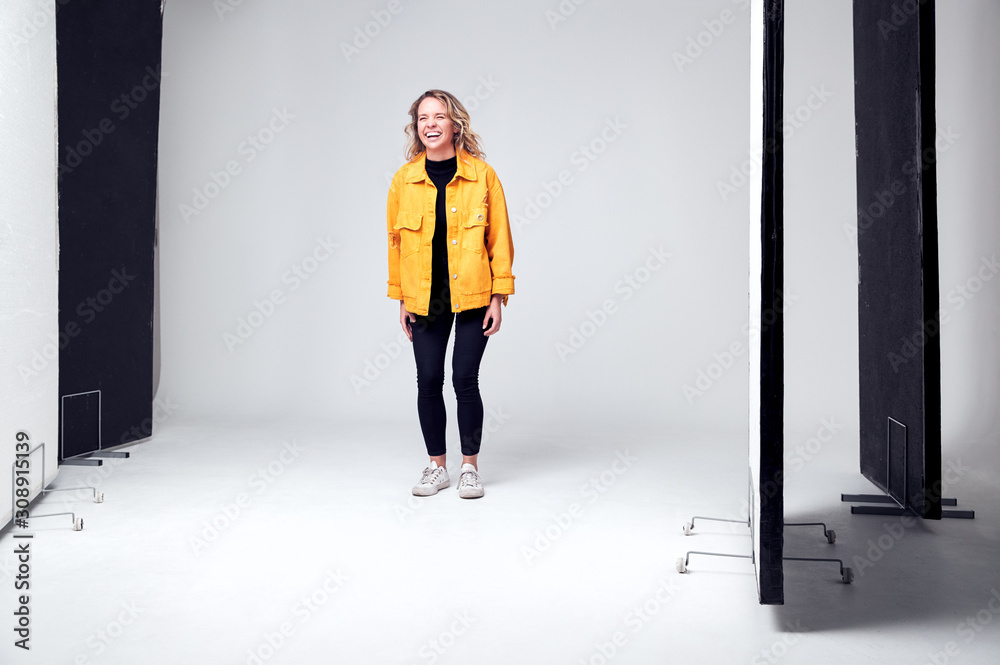 Fototapeta premium Female Model Working On Set In Photographic Or Film Studio
