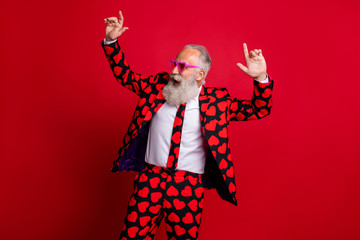 Photo of crazy mature aged handsome guy man moving dancing playing amour cupid role corporate valentine day party wear hearts pattern stylish suit isolated bright color background