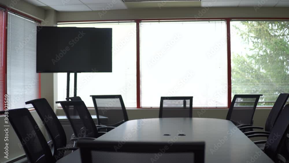 Smooth slider shot of an empty corporate boardroom