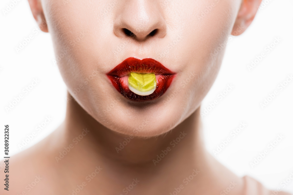 cropped view of woman with red lips holding candy in mouth isolated on white cropped view of woman with red lips holding candy in mouth isolated on white
