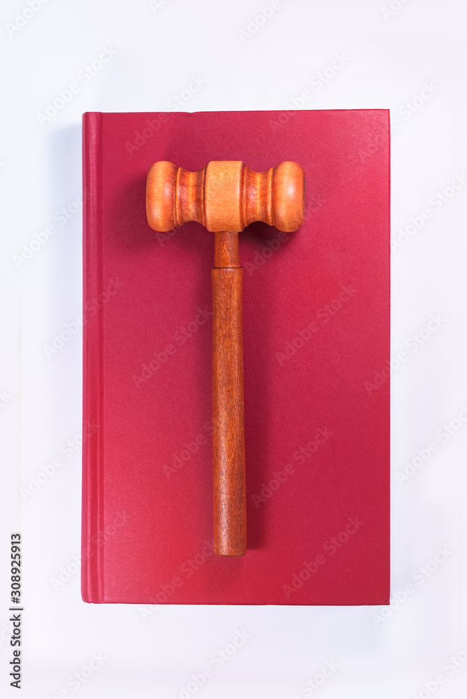 A mallet (hammer) is placed on the book, copyright concept creative map