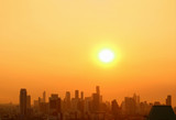 The bright sun rising over the city with copy space
