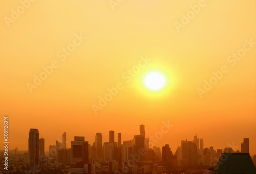 The bright sun rising over the city with copy space