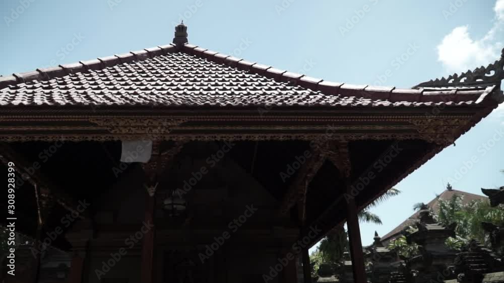 This is inside Ubud Palace. Camera handled, filming pans to the left side and looking from the bottom. Beautiful daytime in the summer while travelling This is inside Ubud Palace. Camera handled, filming pans to the left side and looking from the bottom. Beautiful daytime in the summer while travelling