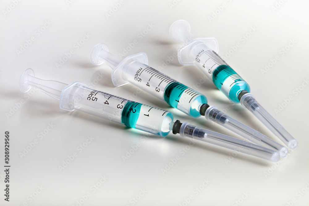 Several syringe on white table prepared for injection in hospital Several syringe on white table prepared for injection in hospital