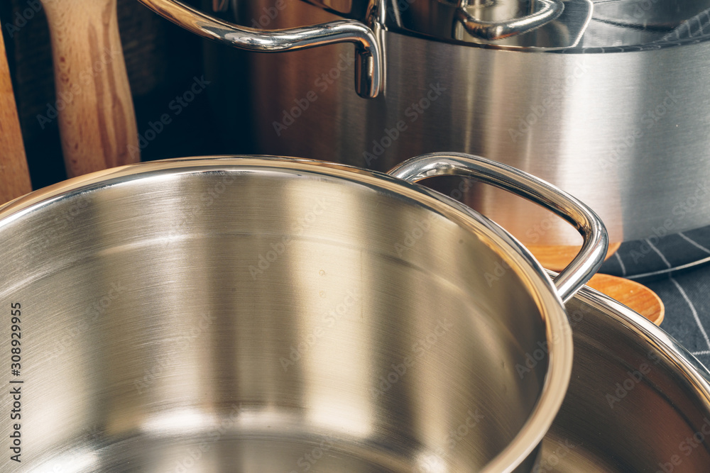 Set of stainless steel saucepans  in a kitchen