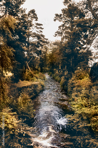 Stimmungsbild Fluss, Bach schlängelt sich durch herbstliche Landschaft im Park vom Blair Castle Schottland photo