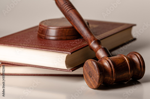 Judge gavel and legal book close up on table