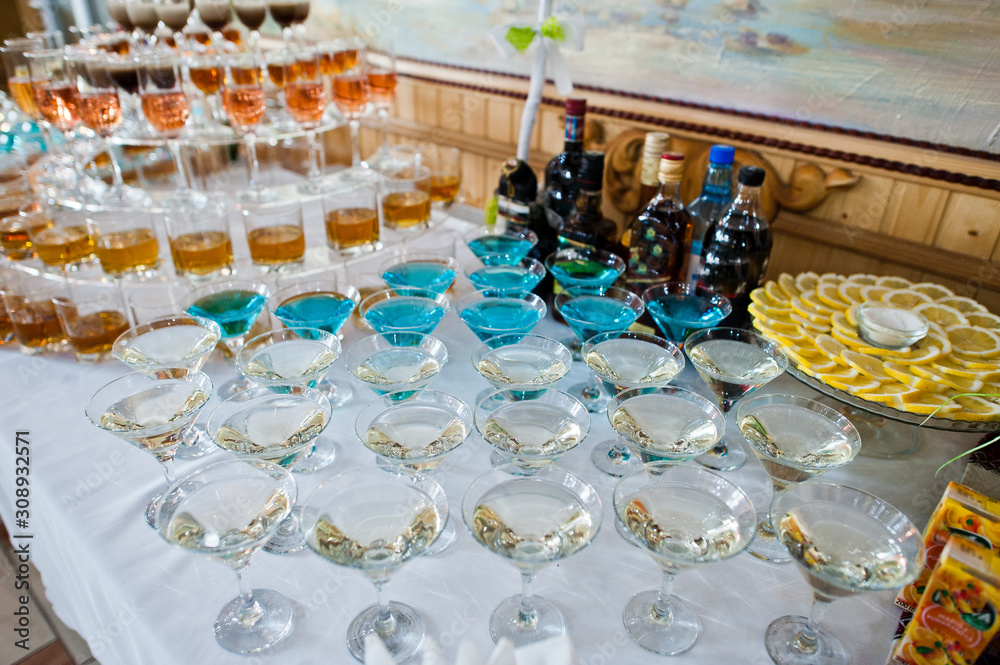 Dessert table of cocktails beverages on wedding reception.