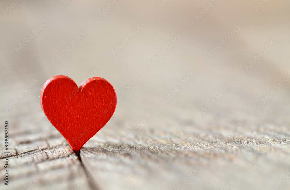 Fototapeta premium A red heart with a blurred background. High resolution photo.