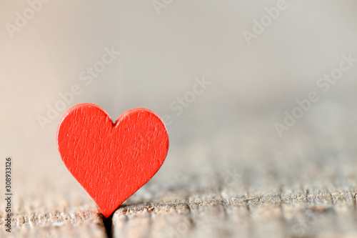 A red heart with a blurred background. High resolution photo.