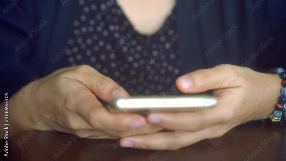 4k video People hand using smartphone with blur cafe shop background. Business, financial, trade stock maket and social network concept. 4k video People hand using smartphone with blur cafe shop background. Business, financial, trade stock maket and social network concept.