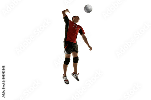 Young caucasian volleyball player placticing isolated on white background. Male sportsman training with the ball in motion and action. Sport  healthy lifestyle  activity  movement concept. Copyspace.