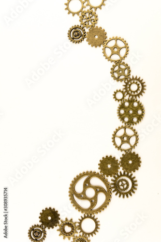 metallic gears background / Closeup of metal cog gears / close up texture pattern steampunk style and old mechanical peaces / decorative frame