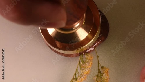 wax melt and stamp pour from wax, close up from above, soft focus